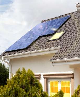 Solar panels on a roof of a house - Solar energy benefits