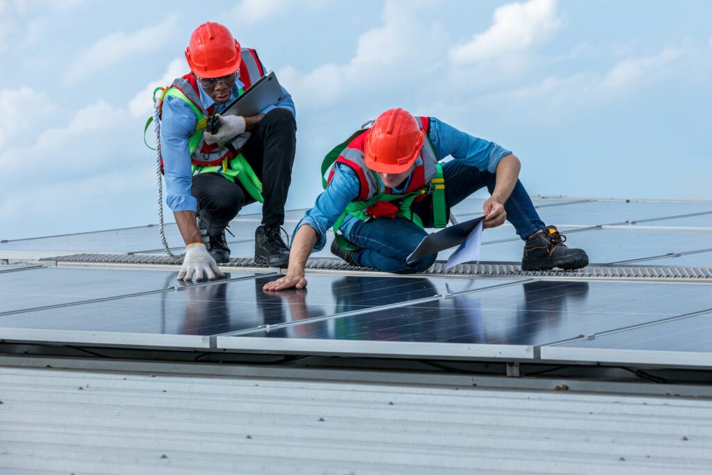 Solar Energy Contractors working on a commercial grid-tied solar system