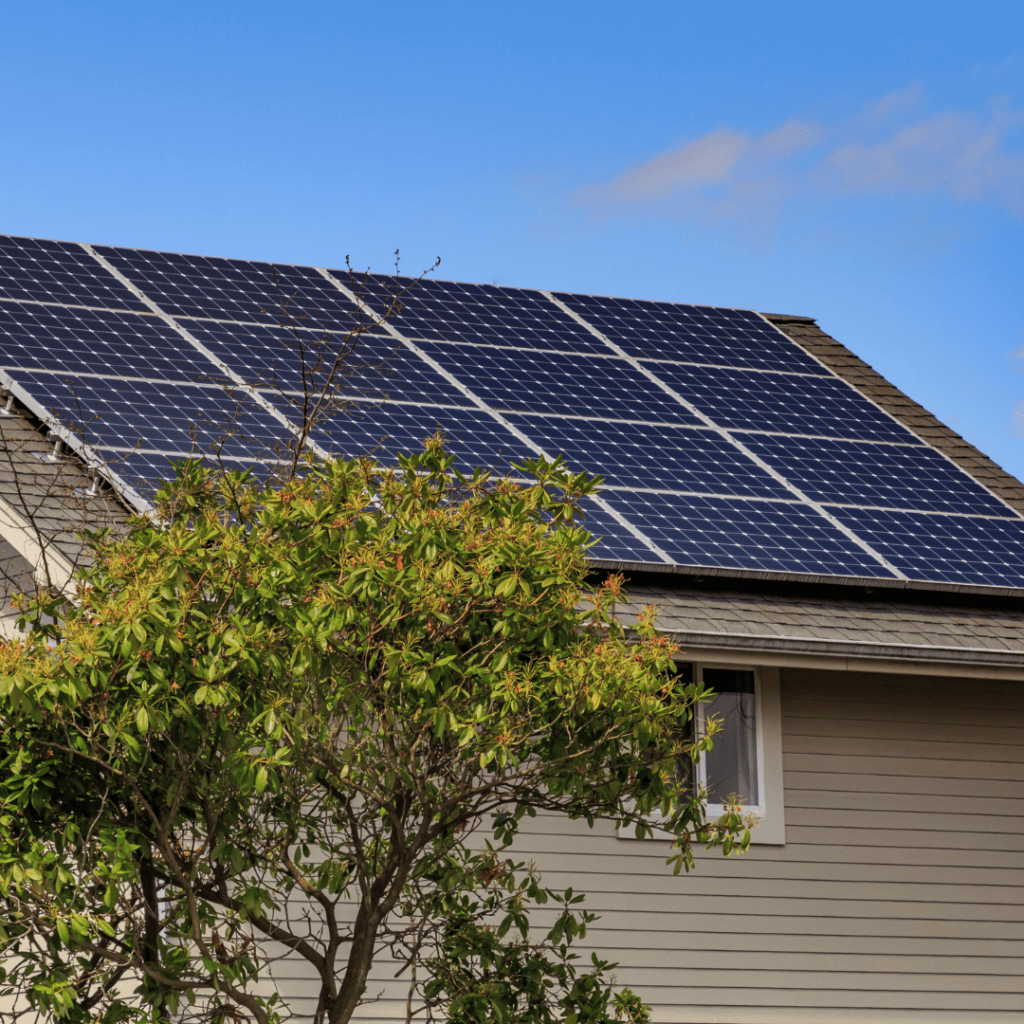 Side of house with solar panels on the roof.